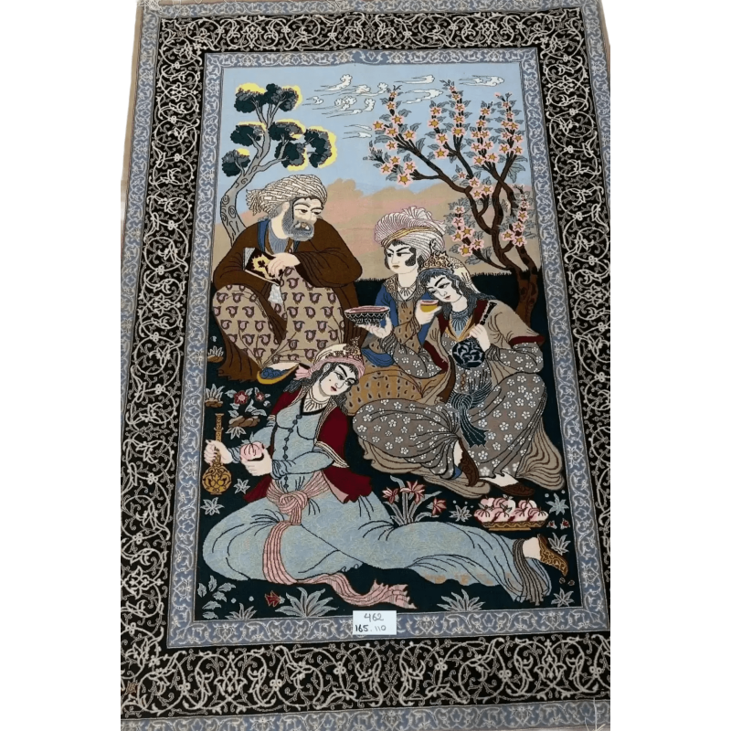 Traditional Isfahan Persian carpet depicting a gathering of individuals in a garden setting