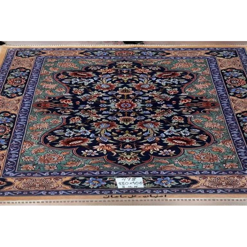 "Hand-knotted Persian rug crafted by Ali Samani in Isfahan, featuring intricate floral patterns in vibrant colors, made from a luxurious blend of wool and silk, perfect for enhancing home decor."