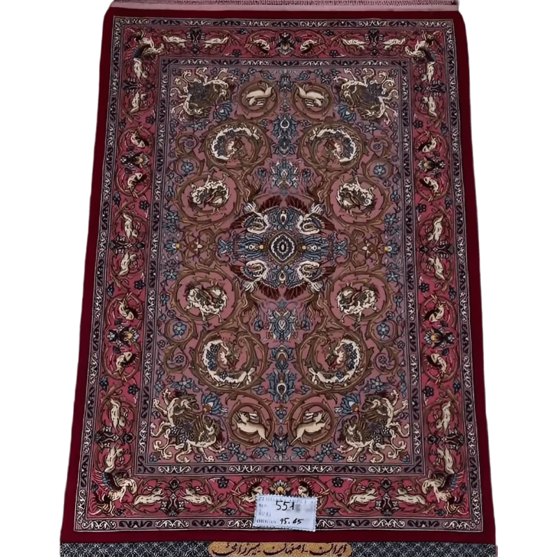 "Hand-knotted Persian rug from Isfahan, 95x65 cm, crafted by Mirzaie with wool and silk, featuring intricate designs and high knot density (810,000 knots/m²). Authentic Persian craftsmanship."