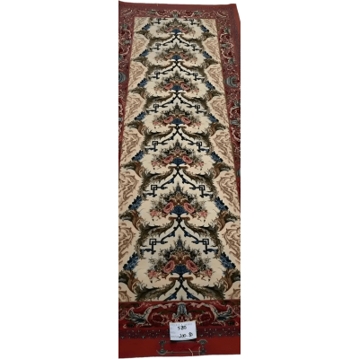 "Vintage-inspired Persian runner rug with red tones, knotted by hand using wool and silk. Dimensions: 200 cm x 80 cm, made in Isfahan, Iran."