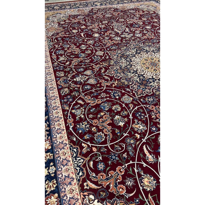"Luxurious Persian rug featuring a burgundy field and floral motifs with navy and gold accents."