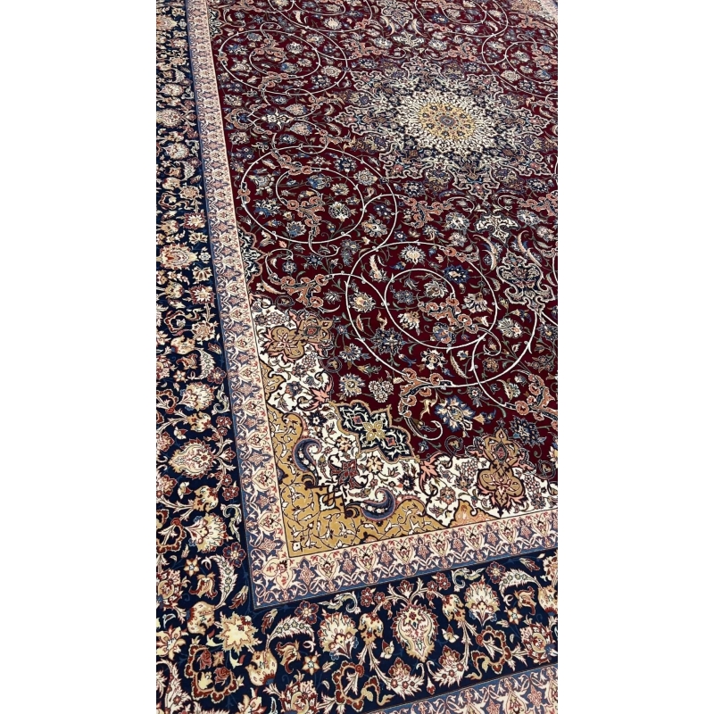 "Close-up of floral and vine patterns on a wool-silk Isfahan rug."