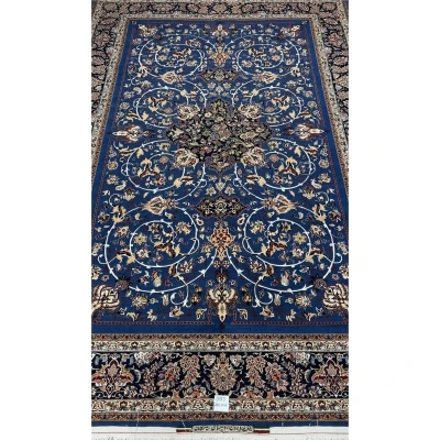"Hand-knotted blue Persian rug by Master Bagher Seirafian with floral designs."
